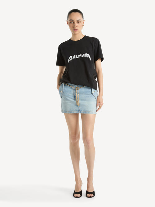 Short skirt in faded denim